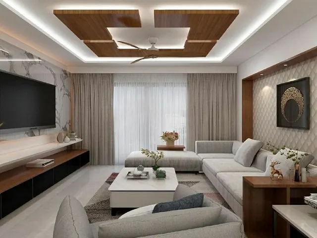 Completed living and dining area with timber false ceiling and sectional sofa
