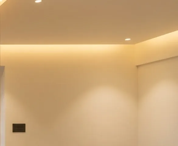 Warm cove lighting along a ceiling edge